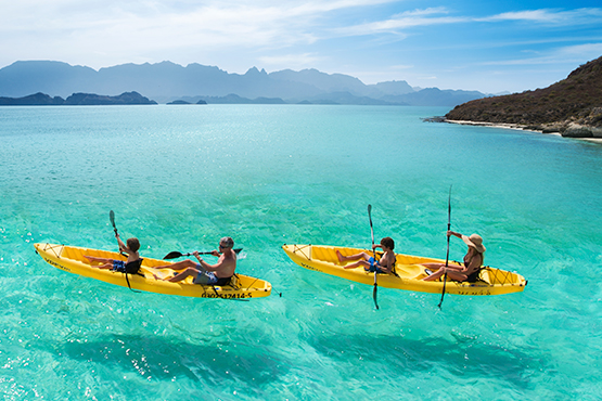 paddle kayak in family at the islands of loreto mexico