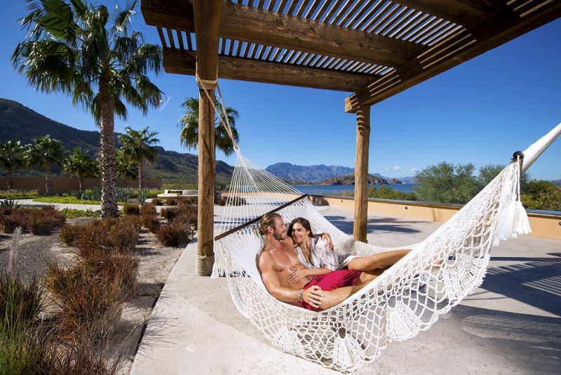 couple relaxing at villa del palmar loreto