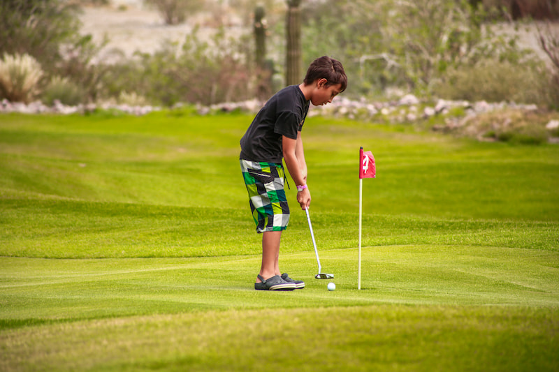 child playing at tpc danzante bay putting course
